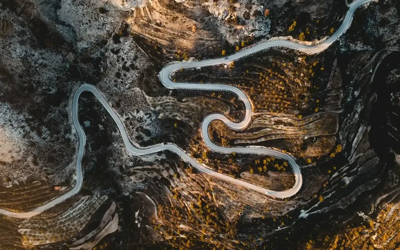 Aerial view of a river winding through rocky terrain